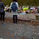 People pause in front of at a memorial for victims of the mass shooting that killed 11 people and wounded 6 at the Tree Of Life Synagogue on October 29, 2018 in Pittsburgh, Pennsylvania.
